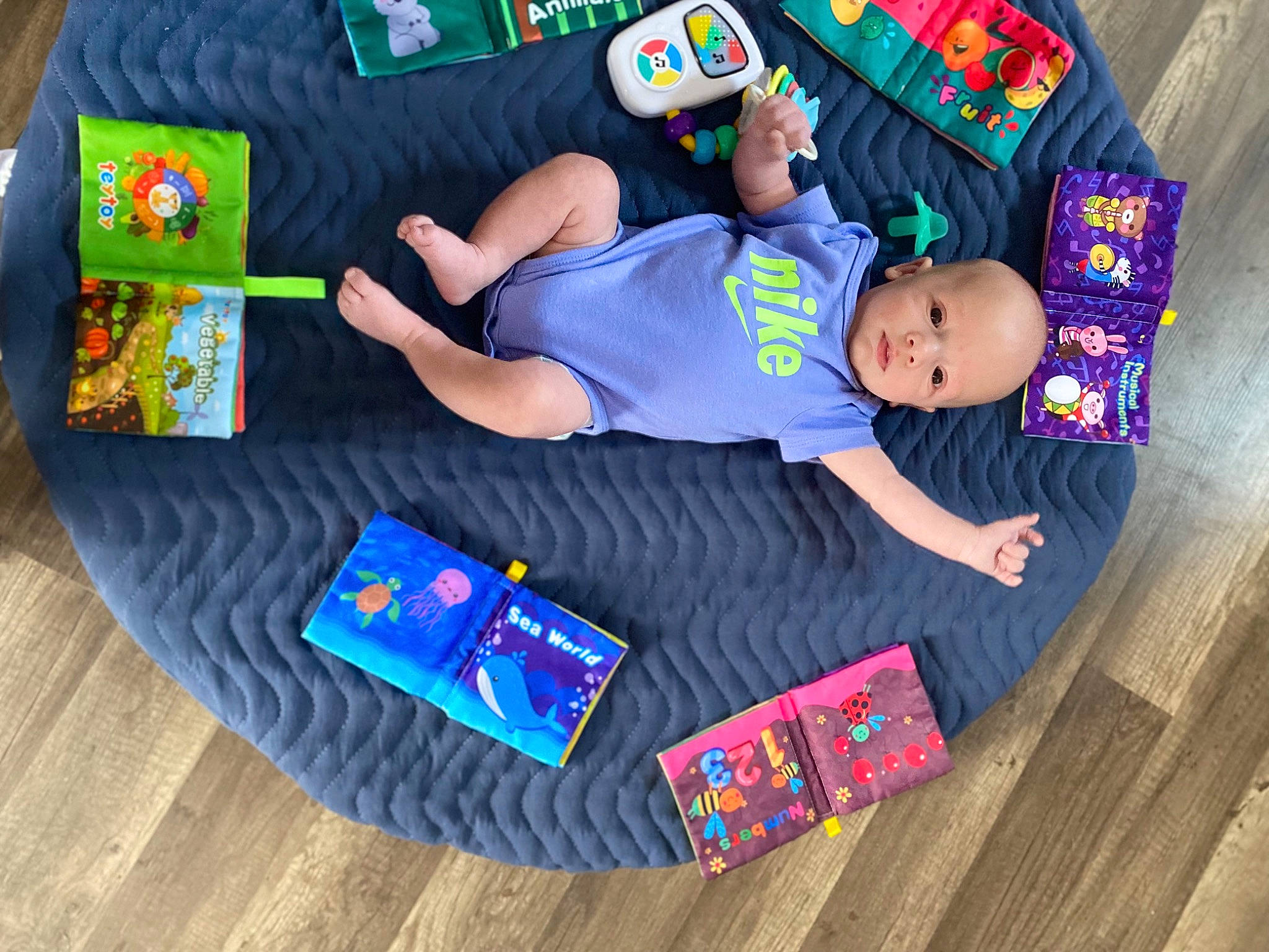 Aaron joined the competition — help win amazing prizes! baby, baby_products, baby_toddler_clothing, child, comfort, electric_blue, flooring, fun, hardwood, hat, leisure, person, play, product, room, shorts, sock, t_shirt, toddler, wood