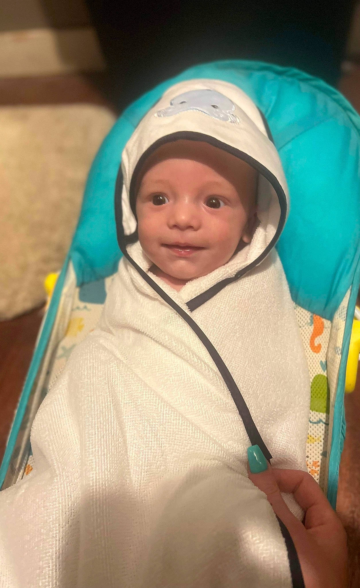 Aaron is registered to the contest to win money with this photo: baby, baby_products, baby_safety, cap, child, eye, eyebrow, face, facial_expression, hat, headgear, headwear, jacket, outerwear, person, product, room, service, skin, sleeve
