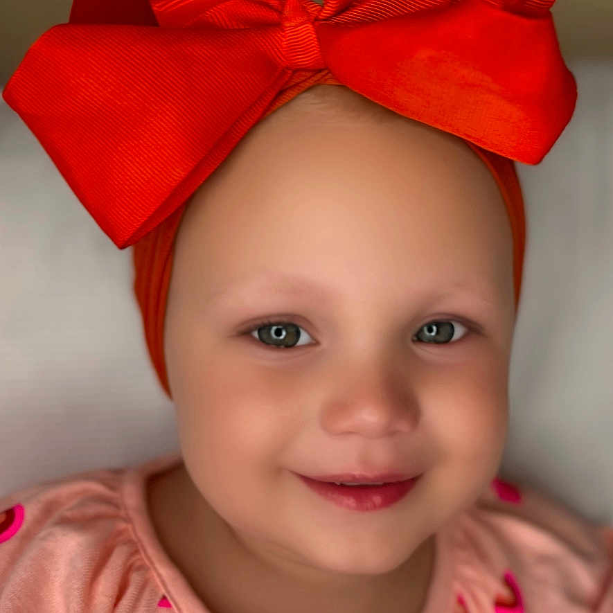 Emberlynn is registered to the contest to win money with this photo: accessories, baby, bodypart, bonnet, cap, clothing, face, finger, formalwear, hand, happy, hat, head, headband, person, photography, portrait, smile, tie, turban