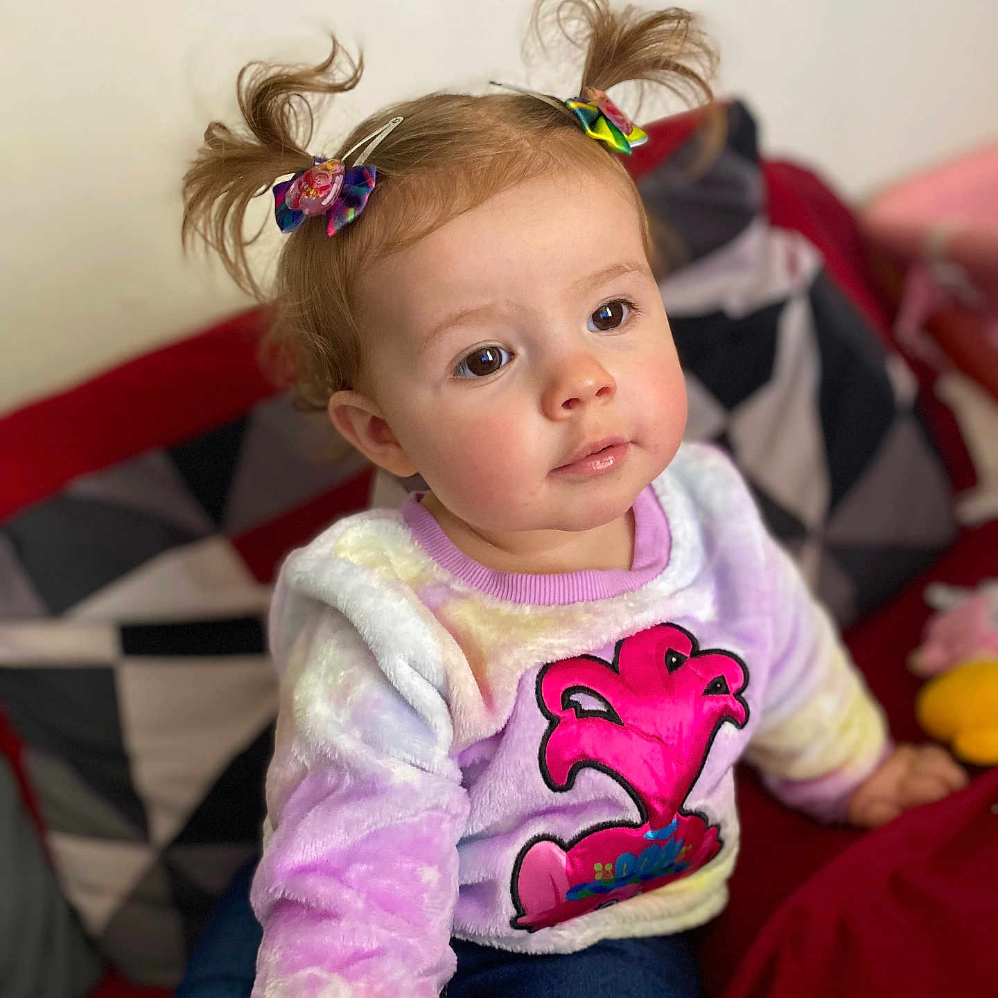 August joined the competition — help win amazing prizes! accessories, baby, bodypart, clothing, couch, cushion, face, finger, furniture, hand, happy, head, homedecor, knitwear, pants, person, photography, portrait, sitting, smile