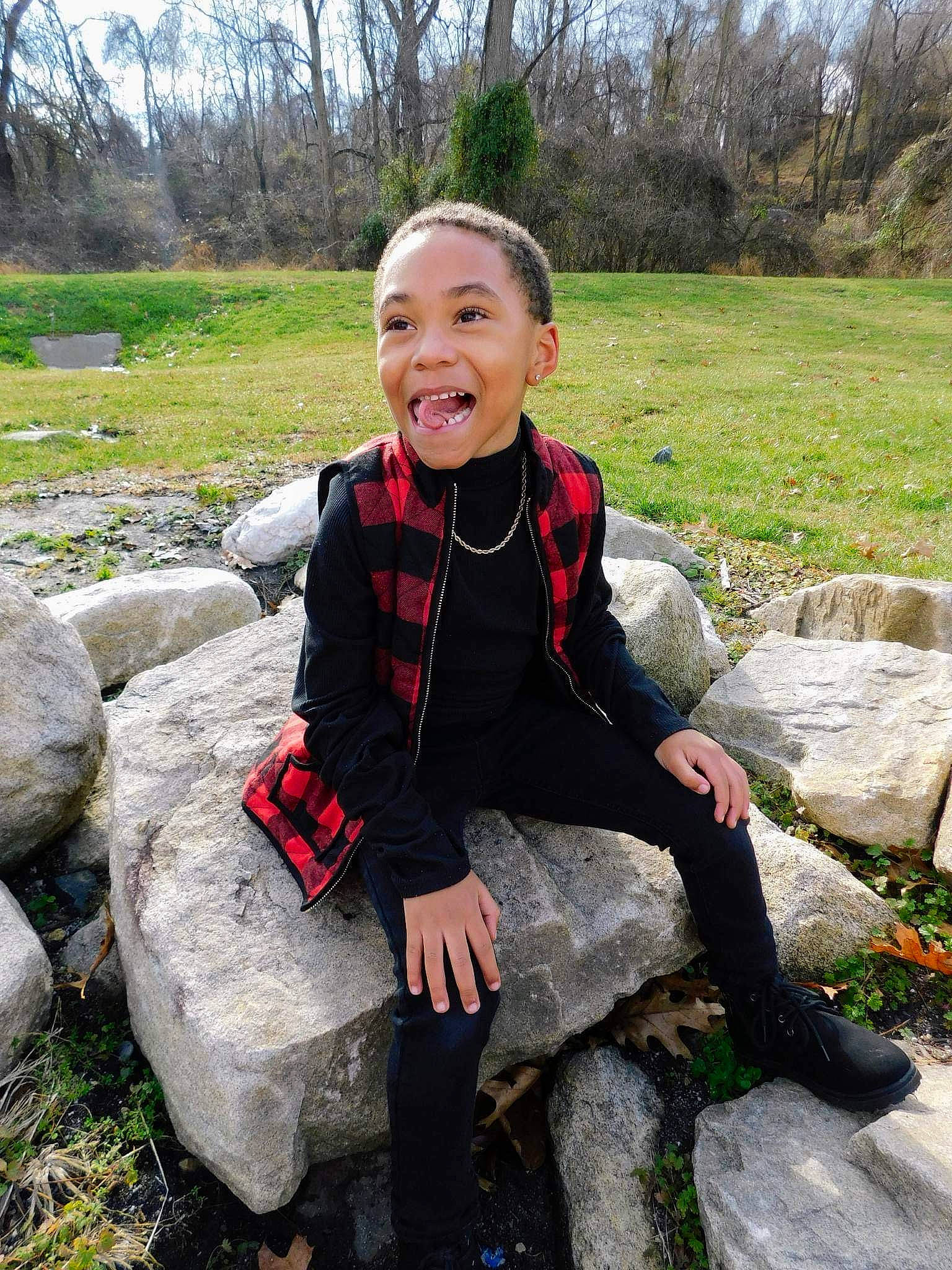 Alden joined the competition — help win amazing prizes! bedrock, botany, fun, grass, happy, human_body, landscape, leaf, leisure, people_in_nature, person, personal_protective_equipment, plant, rock, sitting, smile, toddler, tree, vacation, wilderness