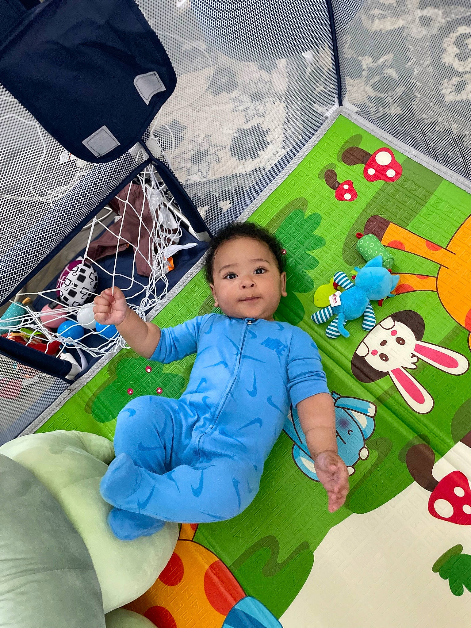 Casen is registered to the contest to win money with this photo: baby, baby_toddler_clothing, bag, chair, child, comfort, electric_blue, fictional_character, fun, games, grass, happy, lap, leisure, pattern, person, play, recreation, sitting, tent