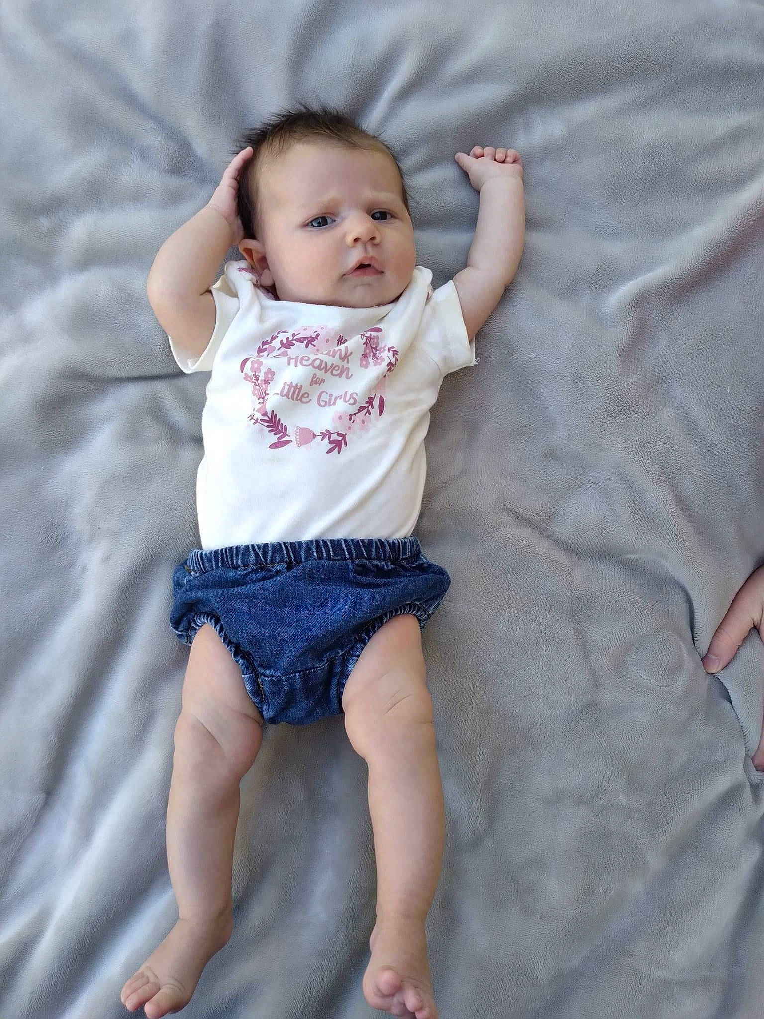 Danielle is registered to the contest to win money with this photo: arm, baby, baby_toddler_clothing, barefoot, comfort, electric_blue, finger, fun, happy, human_leg, joint, pattern, person, pink, skin, sleeve, t_shirt, textile, thigh, toddler