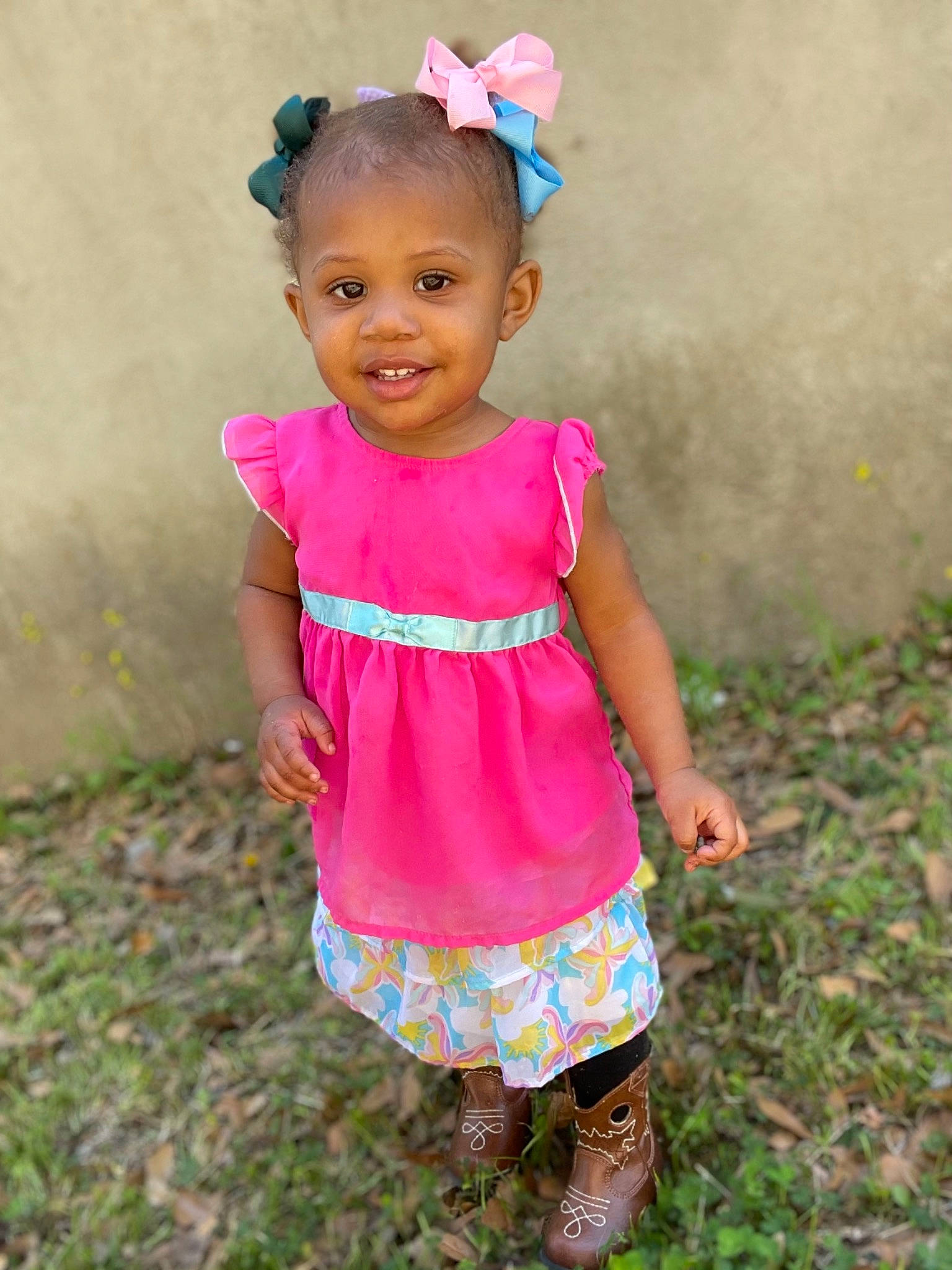 Kimiko Gray is registered to the contest to win money with this photo: arm, baby_toddler_clothing, child, dress, eye, face, fun, grass, happy, head, human_body, joy, magenta, people_in_nature, person, pink, plant, skin, sleeve, smile