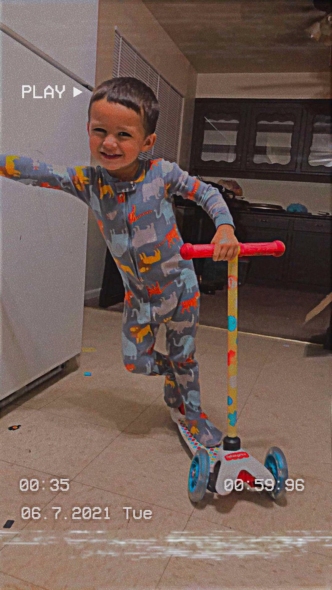 Joel joined the competition — help win amazing prizes! automotive_tire, boot, child, costume, flooring, fun, joy, machine, overall, pattern, person, play, riding_toy, rolling, sleeve, smile, soil, tire, toddler, wheel
