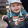 Swan participe au concours pour gagner de l'argent avec cette photo : baby, child, smile, hat, fox, sweater, playground, outdoor, hands, person, toy, seat, animal_ears, happy, face, holding, wooden_bench, tree, nature, daylight