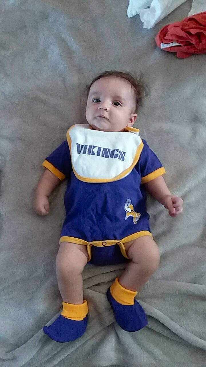 Leroy is registered to the contest to win money with this photo: arm, blue, boy, cheerleading_uniform, child, clothing, costume, fun, girl, infant, joint, leg, material, person, product, skin, smile, textile, toddler, uniform