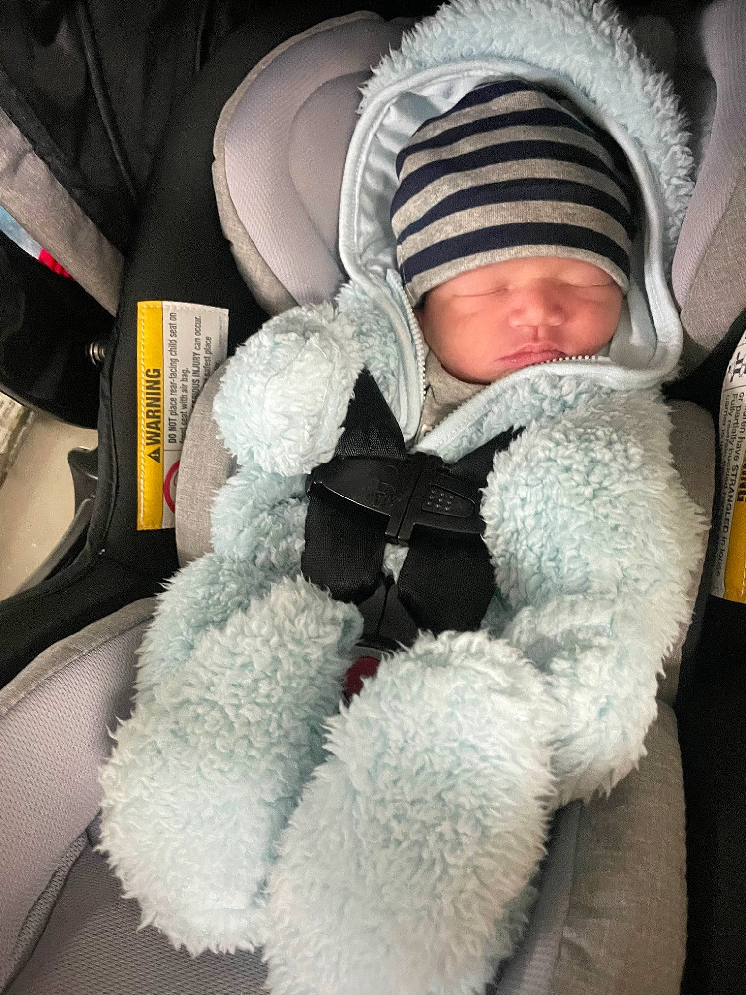 Keaton joined the competition — help win amazing prizes! baby, baby_carriage, baby_products, baby_safety, baby_sleeping, baby_toddler_clothing, beanie, car_seat, child, comfort, eye, fur, fur_clothing, knit_cap, linens, sitting, textile, toddler, winter, wool