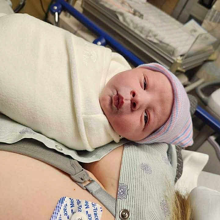 Mordekai joined the competition — help win amazing prizes! baby, bed, blanket, care, closeup, hat, healthcare, hospital, hospital_room, indoor, infant, lying_down, medical_equipment, mother, newborn, newborn_hat, patient, person, postpartum, skin