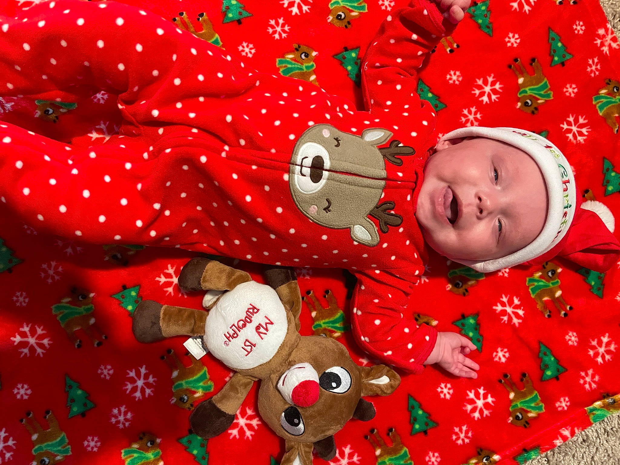Kensleigh is registered to the contest to win money with this photo: baby, baby_toddler_clothing, carmine, christmas, christmas_eve, circle, coquelicot, event, happy, headwear, holiday, linens, pattern, person, petal, red, sleeve, smile, textile, toddler