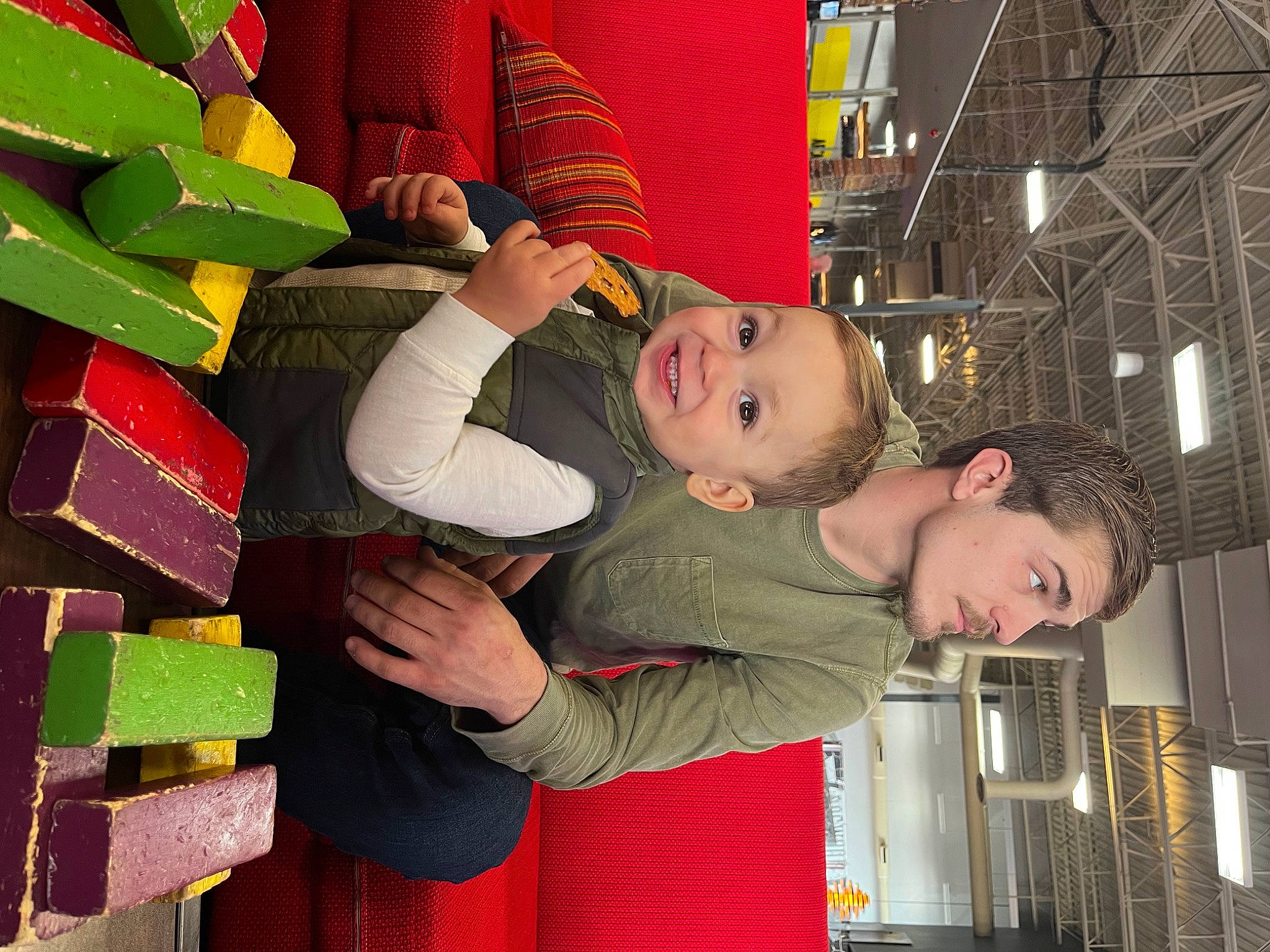 Calvin is registered to the contest to win money with this photo: carmine, child, event, fun, happy, joy, leisure, person, red, room, smile, toddler, world