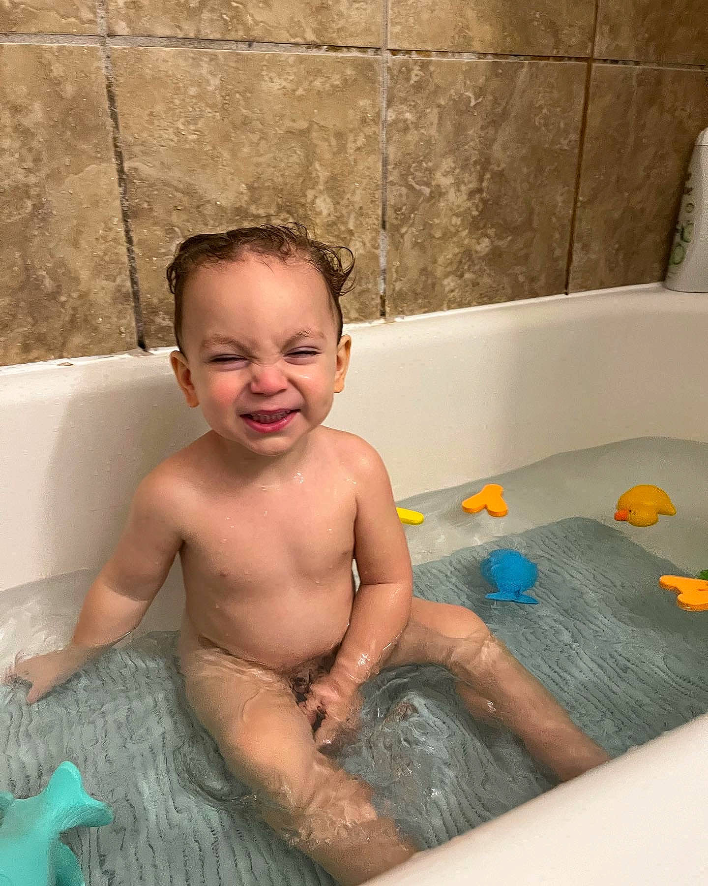 Calvin joined the competition — help win amazing prizes! baby, baby_bathing, bath_toy, bathing, bathroom, bathtub, chest, child, composite_material, fluid, fun, leisure, person, personal_care, photograph, plumbing, recreation, smile, toddler, toy