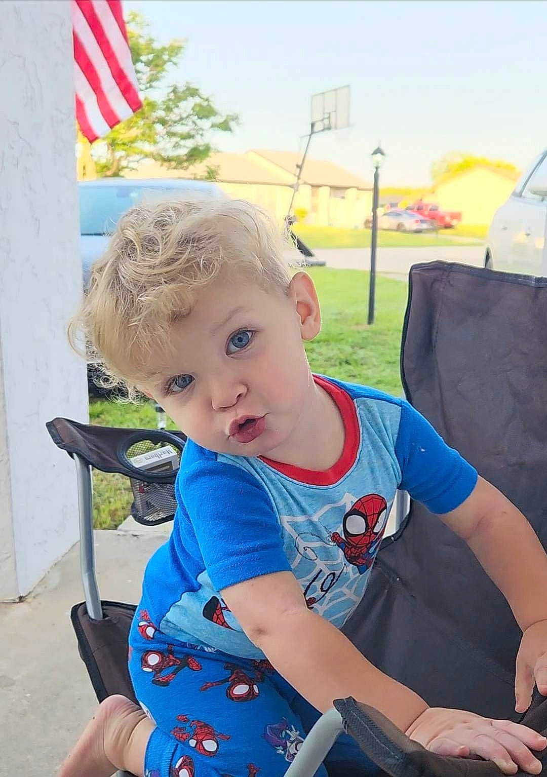 Grayson joined the competition — help win amazing prizes! baby, baby_carriage, baby_products, baby_toddler_clothing, chair, child, electric_blue, flag, folding_chair, fun, grass, happy, leisure, person, personal_protective_equipment, recreation, sitting, sky, t_shirt, toddler