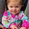 baby, blue_eyes, child, colorful_clothing, cute, face, hand, happy, indoors, infant, onesie, person, playful, portrait, seat, smile, stroller, toddler, toy, young_child
