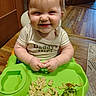 Preszley joined the competition — help win amazing prizes! toddler, child, baby, high_chair, macaroni, broccoli, food, meal, smile, happy, messy, clothing, indoor, wood_floor, tableware, person, face, cute, dining, kitchen