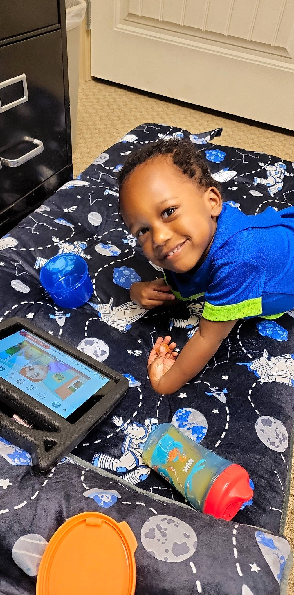 Jacoby joined the competition — help win amazing prizes! audio_equipment, blue, child, display_device, electric_blue, fun, gadget, happy, input_device, joy, multimedia, person, play, room, shirt, shorts, sitting, smile, space, t_shirt