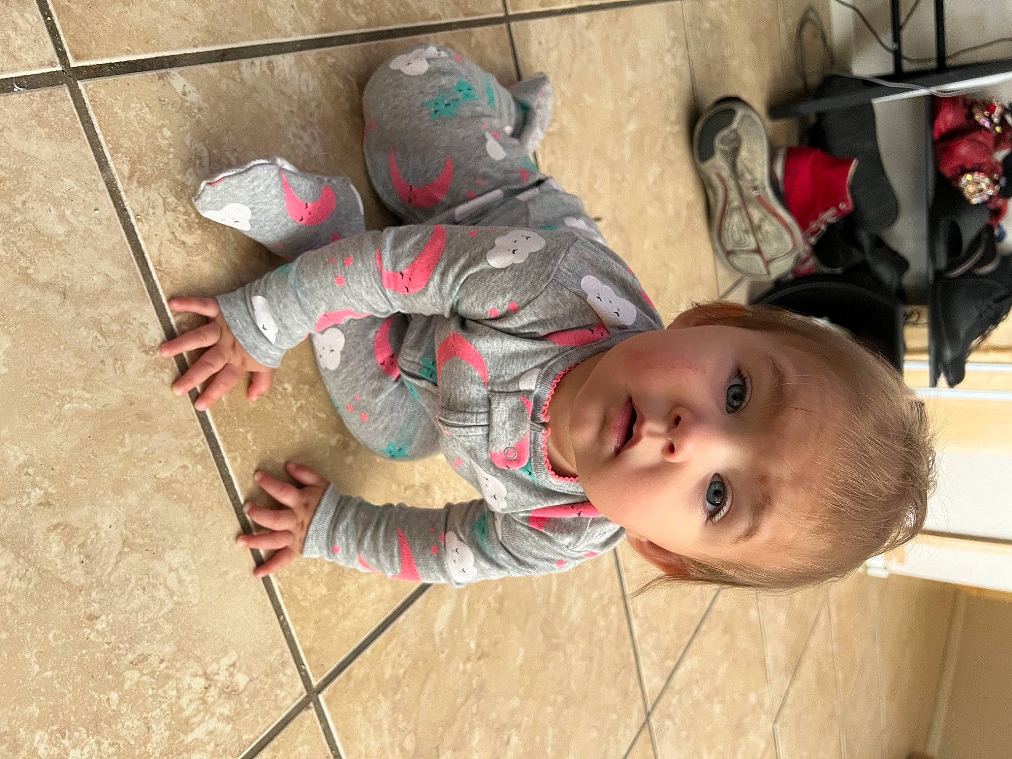 Kairi joined the competition — help win amazing prizes! baby, carmine, child, concrete, flooring, helmet, pattern, person, personal_protective_equipment, sitting, smile, surprise, toddler, tree, wood