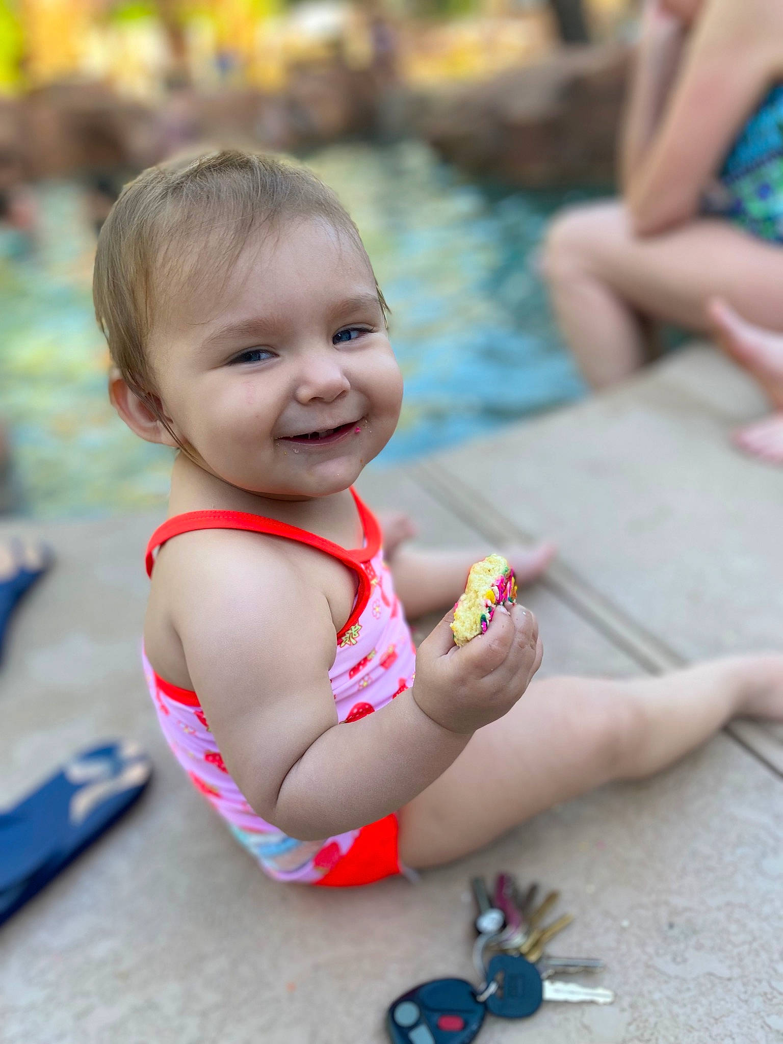 Kairi is registered to the contest to win money with this photo: chest, child, event, foot, fun, grass, happy, human_leg, joy, leisure, nail, person, recreation, sitting, skin, smile, summer, swimwear, toddler, toy