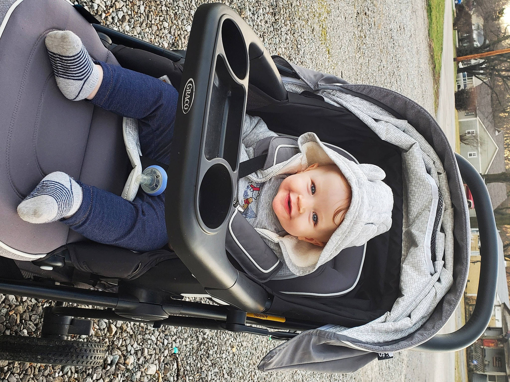 Conrad is registered to the contest to win money with this photo: auto_part, automotive_design, automotive_exterior, automotive_tire, automotive_wheel_system, baby, baby_carriage, baby_products, baby_safety, car_seat, child, comfort, headwear, joy, mode_of_transport, motor_vehicle, person, smile, tire, toddler