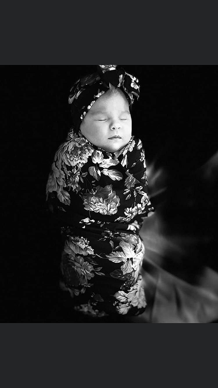 Harper is registered to the contest to win money with this photo: art, baby, baby_toddler_clothing, cap, cheek, darkness, fashion_accessory, flash_photography, gesture, happy, headpiece, iris, jewellery, monochrome, monochrome_photography, pattern, person, personal_protective_equipment, sitting, sleeve