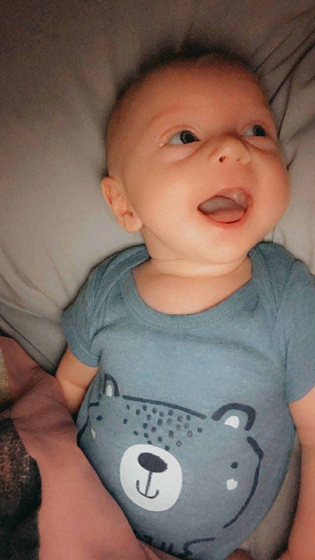 Sawyer is registered to the contest to win money with this photo: arm, baby, baby_toddler_clothing, cheek, chin, eye, face, facial_expression, human_body, iris, joint, lip, mouth, neck, nose, organ, person, shoulder, skin, sleeve