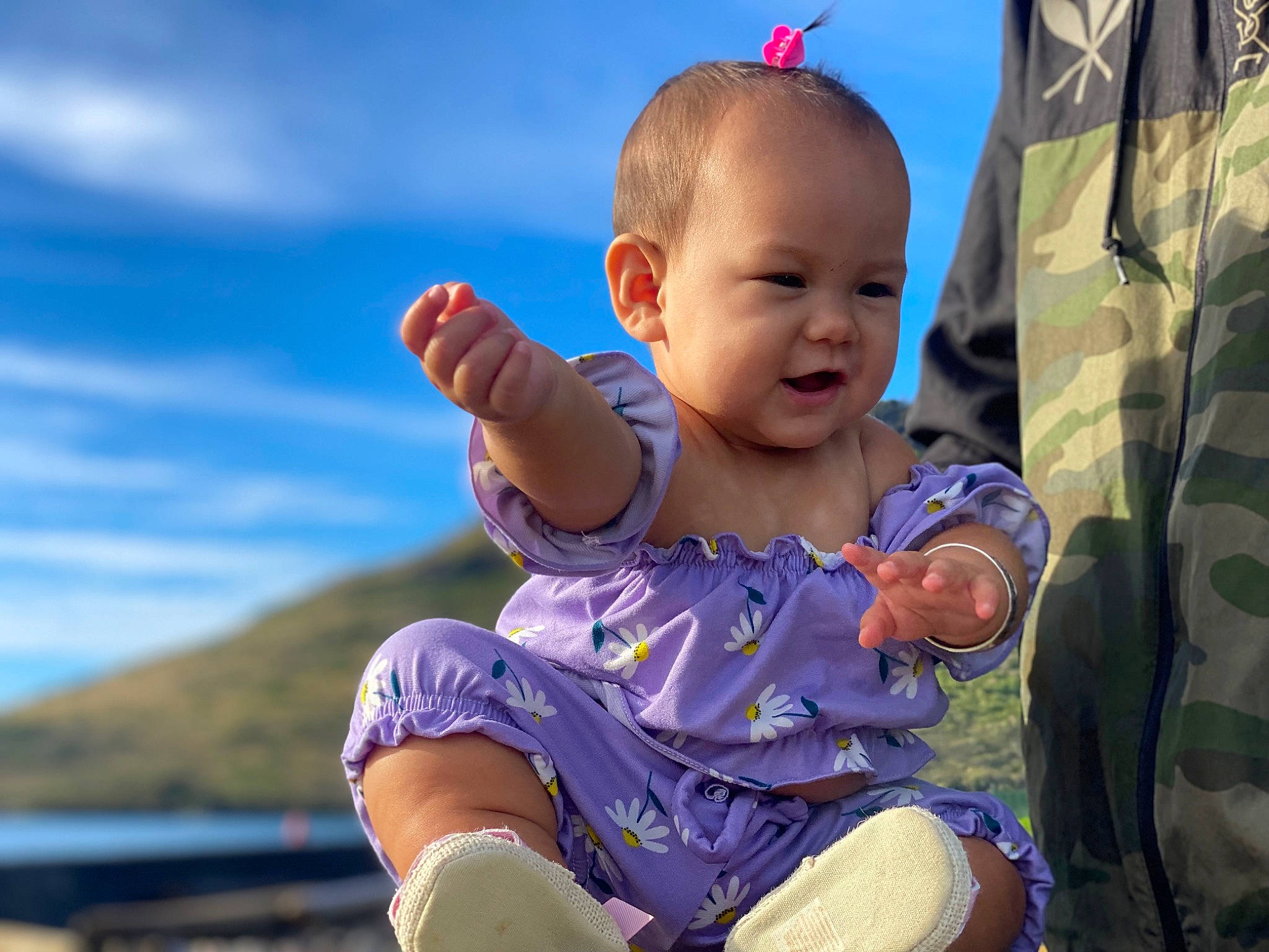 Kailia is registered to the contest to win money with this photo: baby, baby_toddler_clothing, child, cloud, flash_photography, fun, gesture, grass, happy, leisure, people_in_nature, person, play, recreation, sitting, skin, sky, smile, summer, toddler