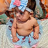 baby, child, tutu, bow, headband, bare_chest, sitting, blanket, curious, indoors, footwear_none, pink_pants, cute, infant, portrait, decorative_background, animal_painting, soft_texture, skin, person