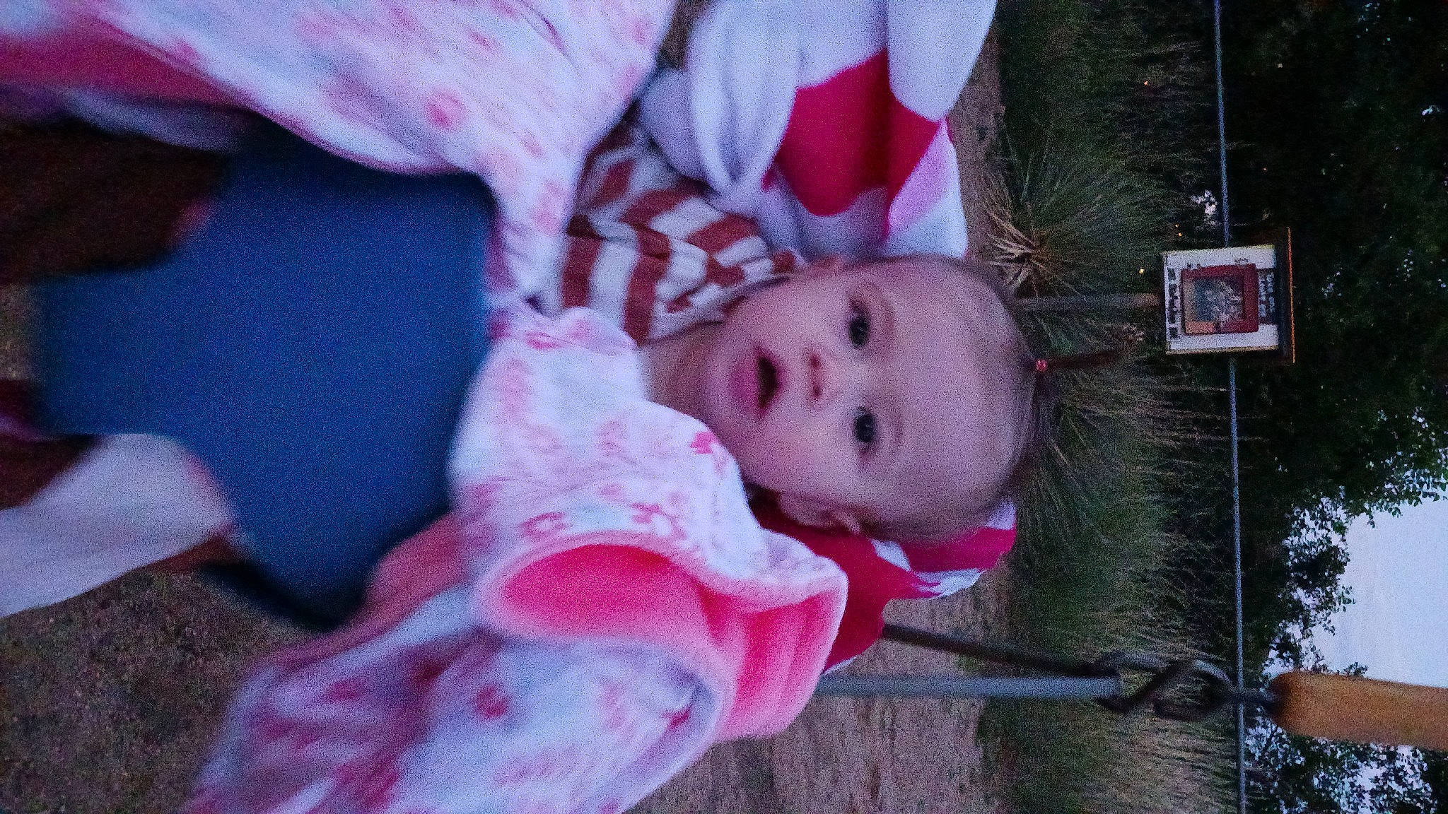 Aryanna is registered to the contest to win money with this photo: baby, baby_products, baby_toddler_clothing, cheek, child, comfort, fun, fur, grass, happy, lip, magenta, person, pink, plant, sitting, skin, textile, toddler, tree