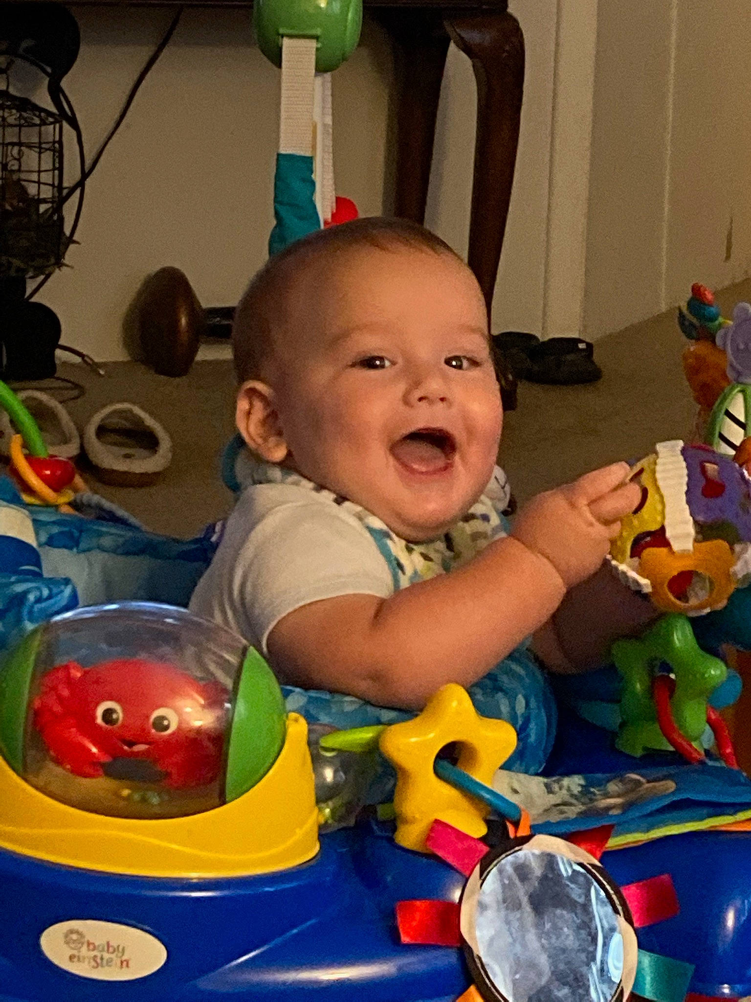 Benson is registered to the contest to win money with this photo: baby, baby_playing_with_toys, baby_products, baby_toddler_clothing, baby_toys, child, event, fun, happy, leisure, person, play, product, recreation, riding_toy, room, sitting, smile, toddler, toy