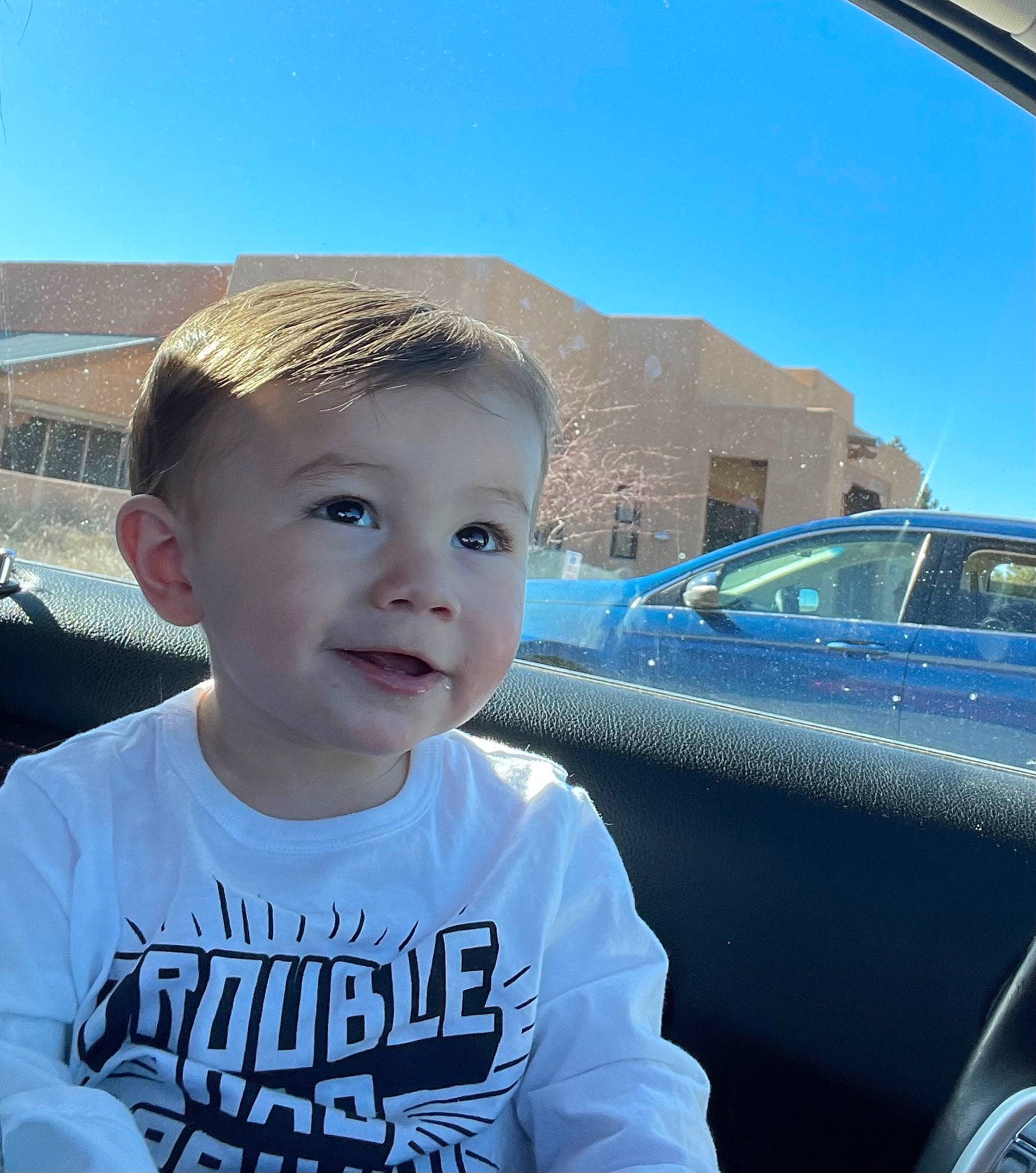 Cody is registered to the contest to win money with this photo: automotive_design, automotive_exterior, automotive_lighting, automotive_mirror, car, cool, electric_blue, eyewear, happy, hood, motor_vehicle, person, personal_luxury_car, rear_view_mirror, sky, t_shirt, tints_and_shades, toddler, vehicle, vehicle_door