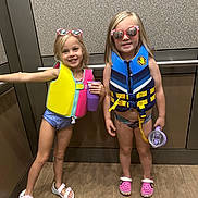 Teagan joined the competition — help win amazing prizes! accessories, child, clothing, cup, disposablecup, face, female, footwear, girl, glasses, head, lifejacket, person, photography, portrait, shoe, shorts, sneaker, sunglasses, vest
