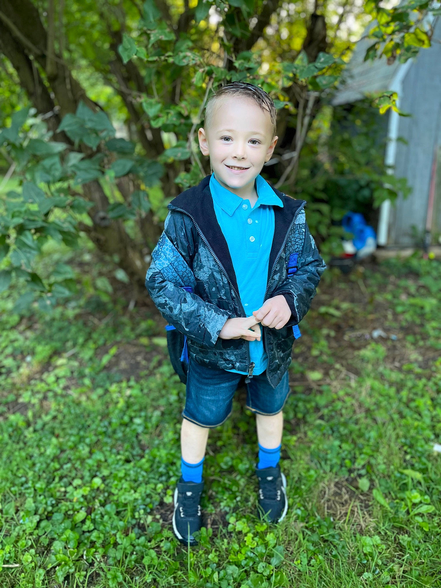 Aiden is registered to the contest to win money with this photo: child, electric_blue, eye, face, footwear, forest, formal_wear, grass, happy, head, joy, leisure, outerwear, people_in_nature, person, plant, shorts, sleeve, smile, tie