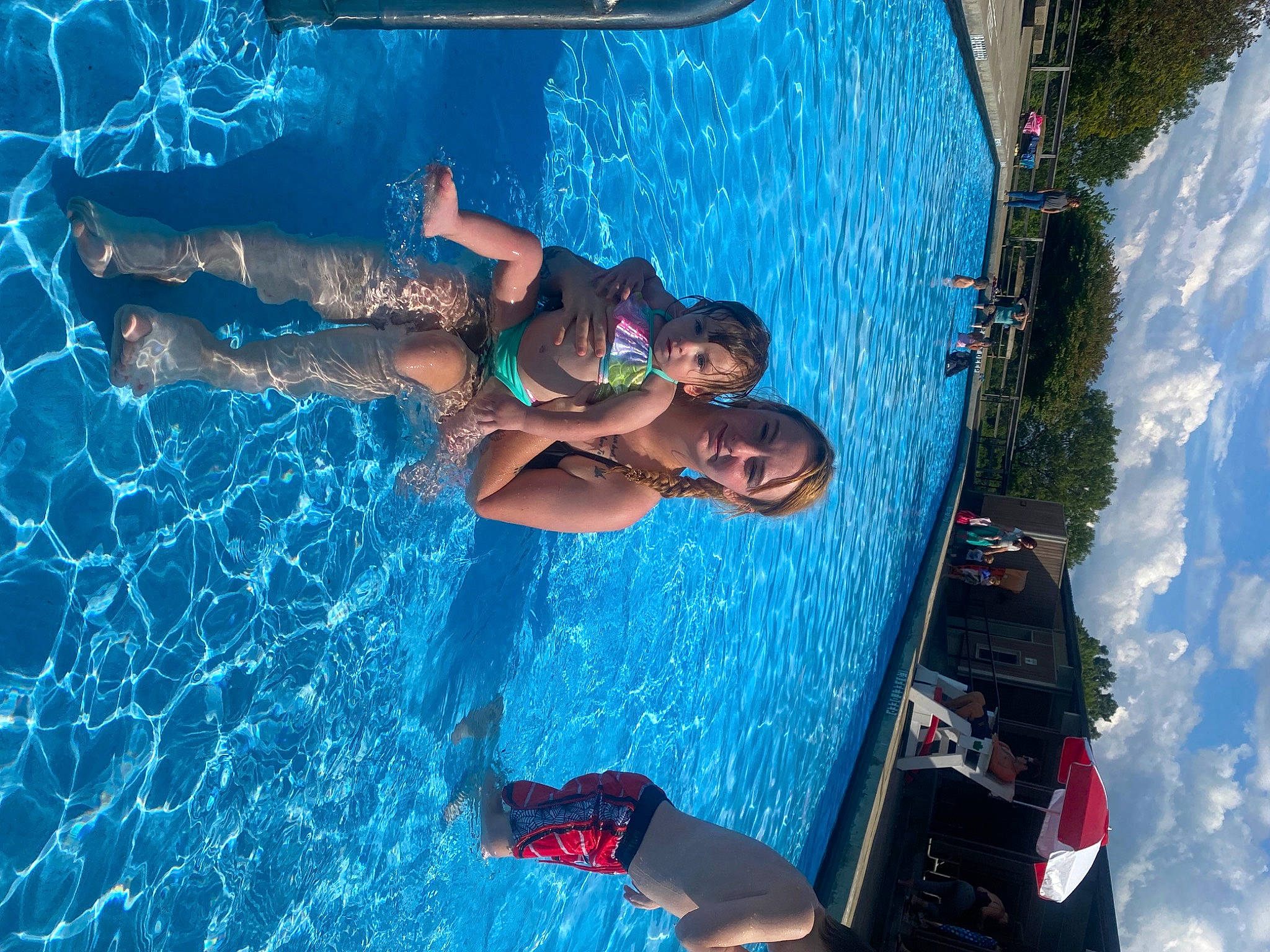 Gracelyn is registered to the contest to win money with this photo: azure, elbow, electric_blue, fun, games, happy, leisure, leisure_centre, nonbuilding_structure, outdoor_recreation, person, recreation, sky, swimmer, swimming_pool, toddler, travel, water, water_park, wave