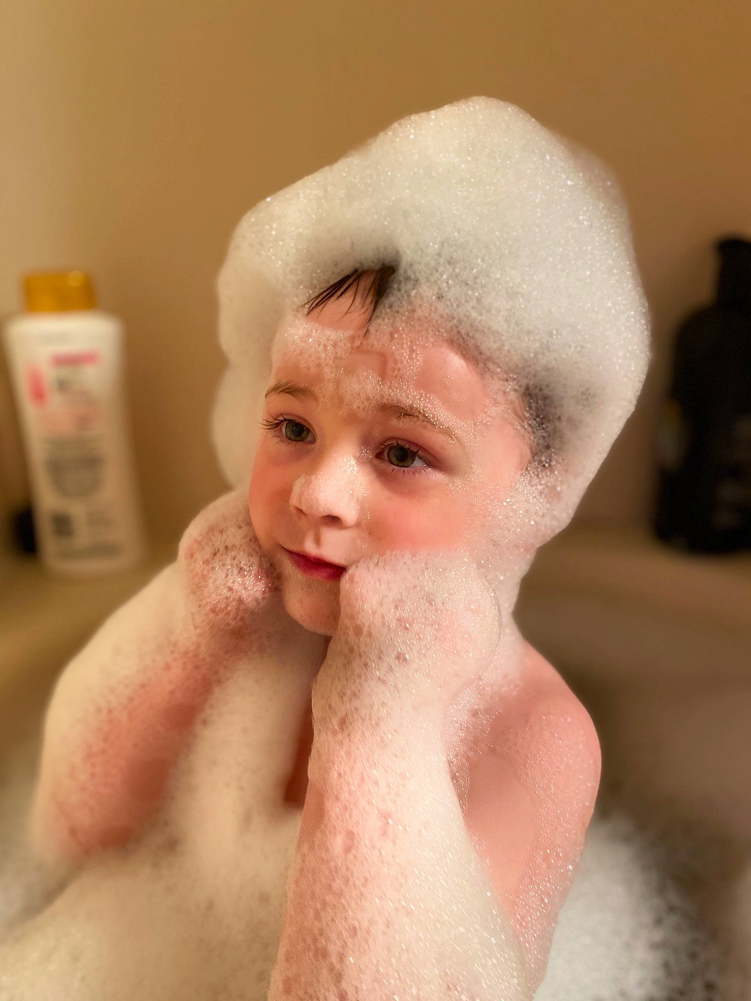 Aiden is registered to the contest to win money with this photo: barechested, bathing, cheek, child, chin, eyebrow, face, foam, forehead, fur, hair, head, lip, mouth, neck, nose, person, skin, smile, towel