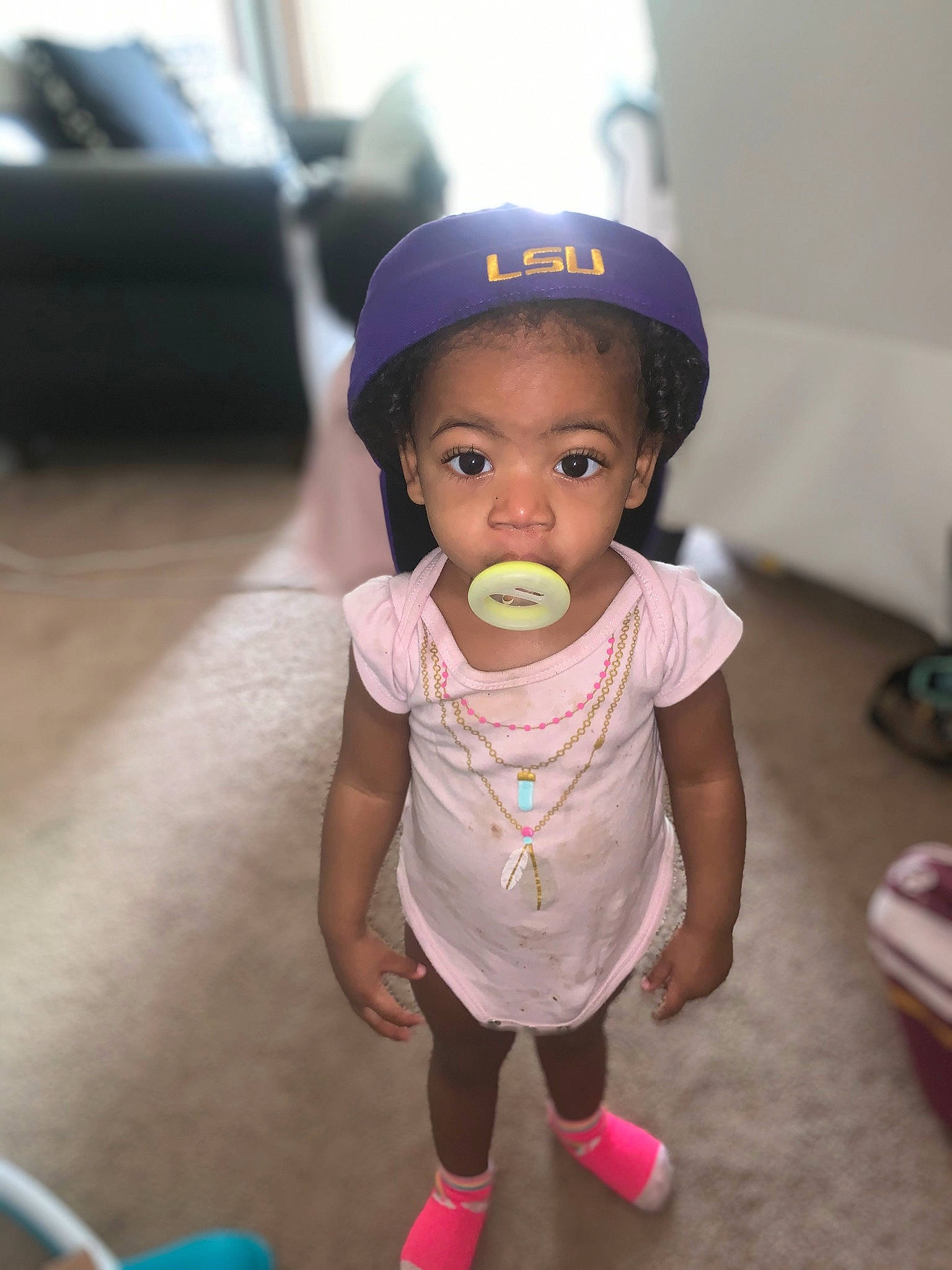 Khloee joined the competition — help win amazing prizes! baby, baby_toddler_clothing, cap, cheek, child, eye, face, fashion_accessory, fun, happy, helmet, magenta, person, personal_protective_equipment, pink, play, shorts, sitting, sleeve, t_shirt