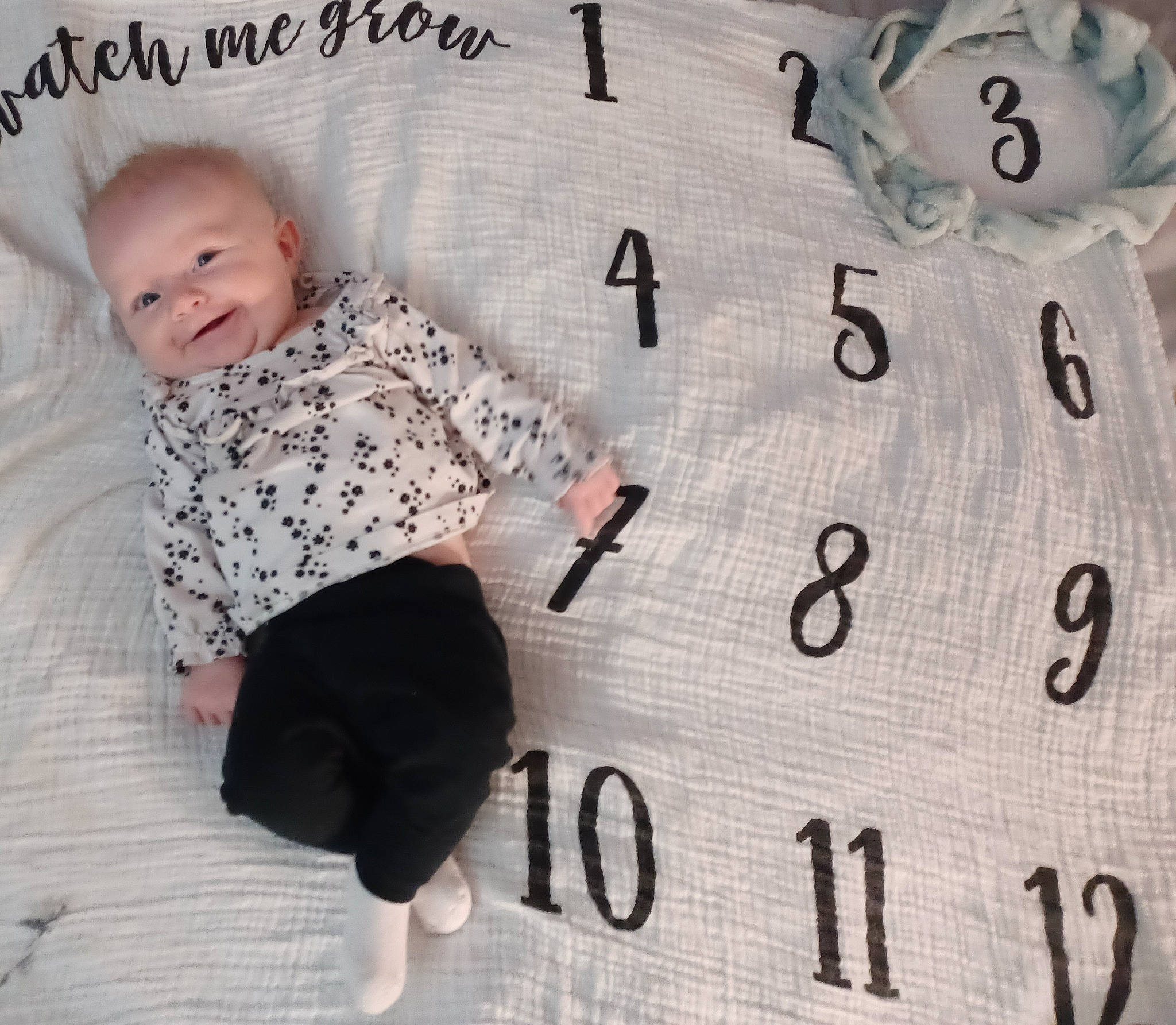 Amariah Dozier is registered to the contest to win money with this photo: baby, baby_products, baby_toddler_clothing, bedding, carmine, child, comfort, flooring, font, happy, linens, number, pattern, person, product, sleeve, smile, t_shirt, toddler, white