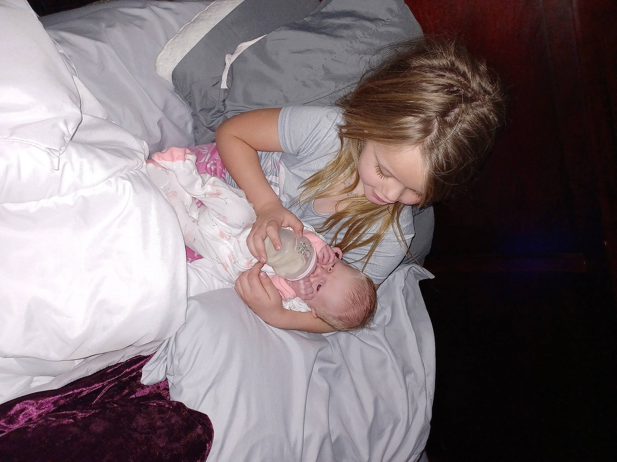 Heavenly is registered to the contest to win money with this photo: baby, baby_products, blond, child, comfort, couch, dress, event, flash_photography, formal_wear, fun, gesture, hand, happy, lap, linens, person, room, shoulder, sitting