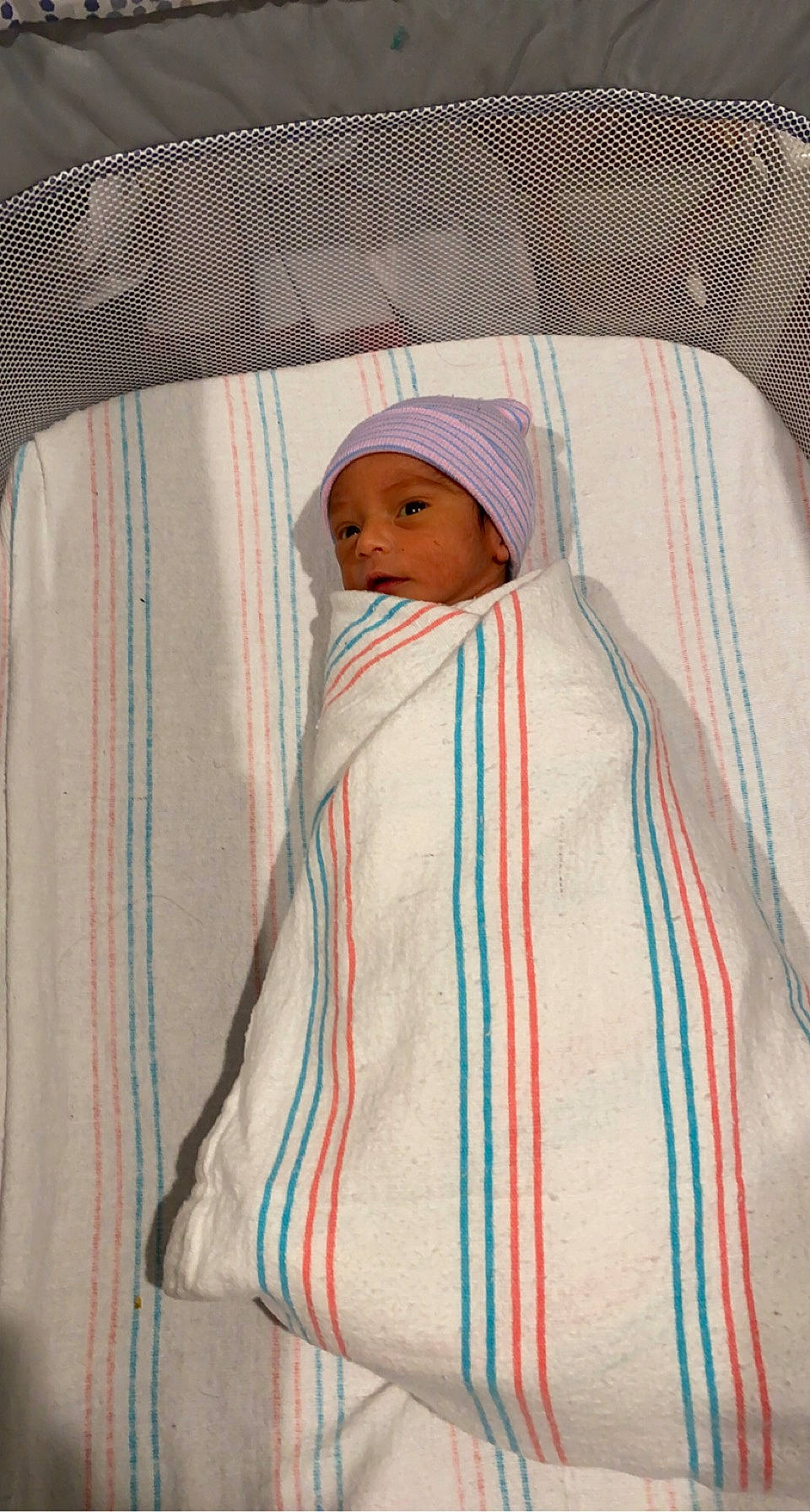 Jaeden joined the competition — help win amazing prizes! baby, baby_products, bed_sheet, bedding, blanket, child, comfort, headwear, linens, outerwear, pattern, peach, person, pink, room, sleeve, textile, toddler, towel, wood