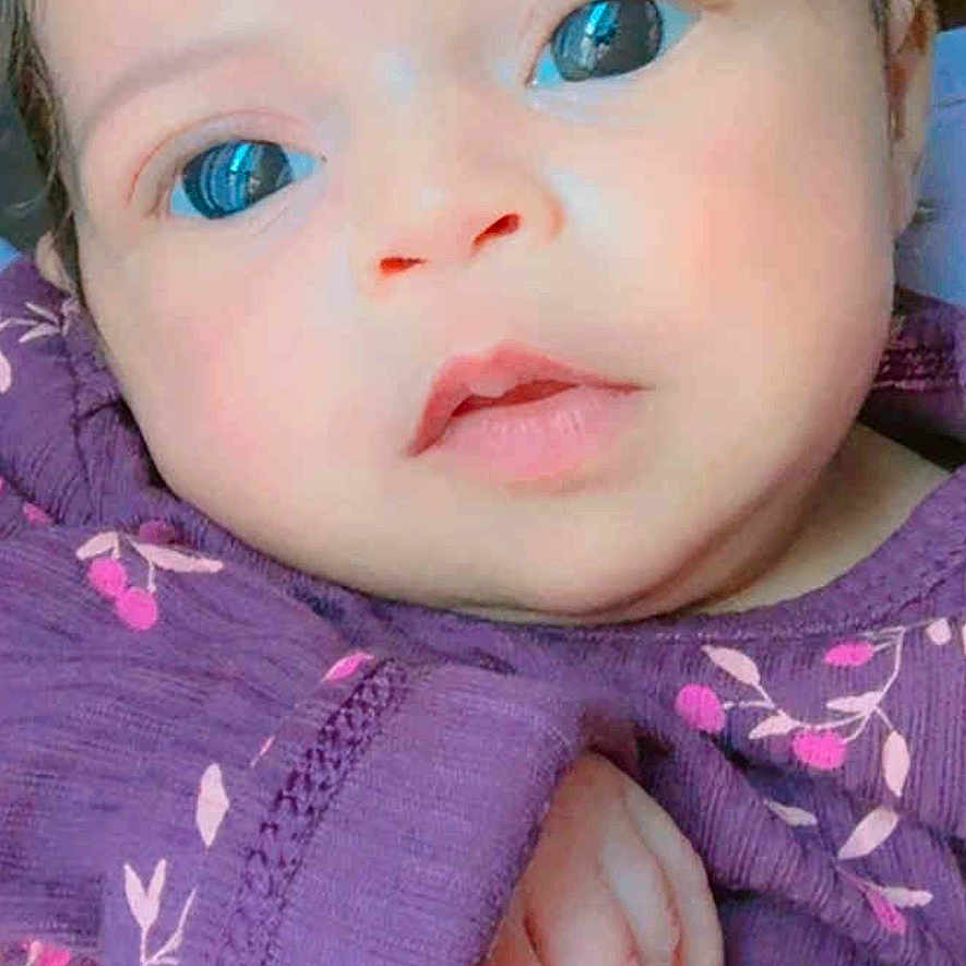 Jucyanne joined the competition — help win amazing prizes! baby, child, closeup, cute, expression, eyes, face, floral_pattern, hand, human, indoors, infant, newborn, person, portrait, purple_clothing, skin, soft_lighting, toddler, young