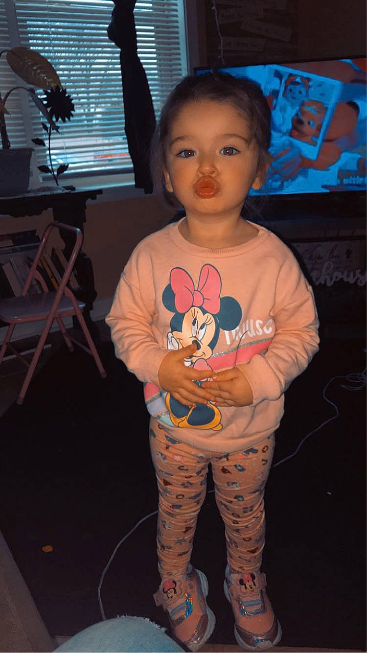 Myla is registered to the contest to win money with this photo: art, cheek, child, cool, costume, eye, flesh, flooring, fun, hairstyle, happy, head, person, shoulder, sitting, sleeve, t_shirt, textile, toddler, top