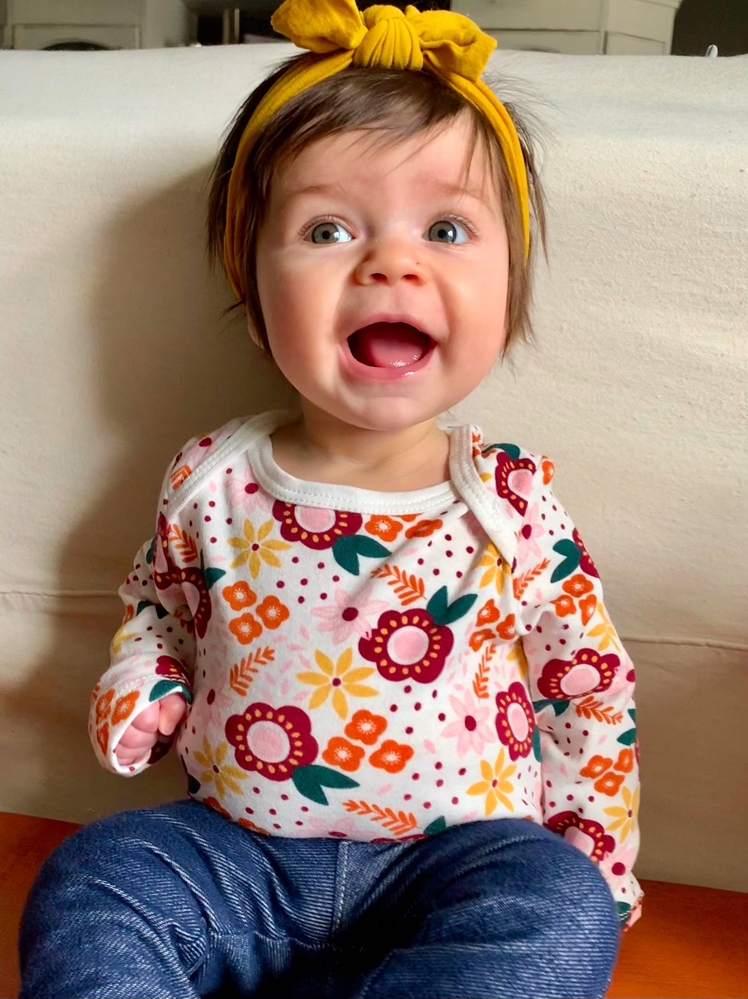 Adelaide is registered to the contest to win money with this photo: baby_toddler_clothing, cheek, chin, clothing, dress, facial_expression, iris, jeans, lip, mouth, neck, nose, orange, organ, person, product, skin, sleeve, standing, white