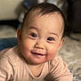baby, carpet, child, clothing, cute, drool, eyes, face, furniture, hand, happy, home, indoor, infant, mouth, person, play, skin, smile, toy