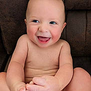 Jace joined the competition — help win amazing prizes! baby, child, infant, smiling, happy, portrait, face, eyes, cheeks, sitting, barefoot, toes, hands, diaper, skin, leather_chair, indoor, closeup, adorable, photography