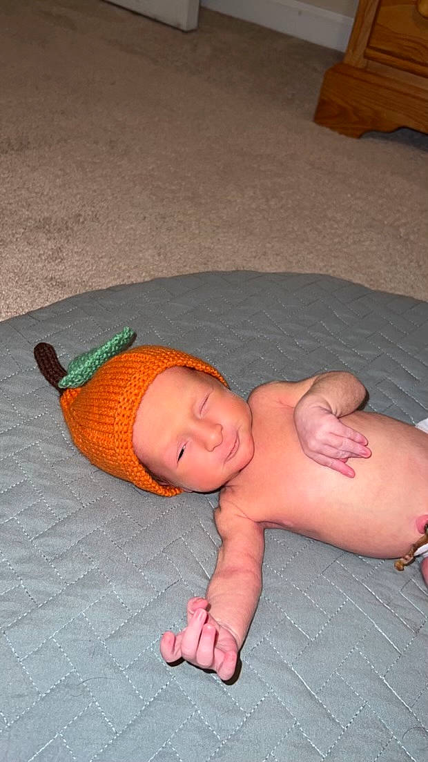 Walker is registered to the contest to win money with this photo: abdomen, baby, baby_products, baby_toddler_clothing, barefoot, cheek, chest, chin, comfort, flooring, foot, head, human_body, human_leg, person, stomach, thumb, toddler, trunk, wood