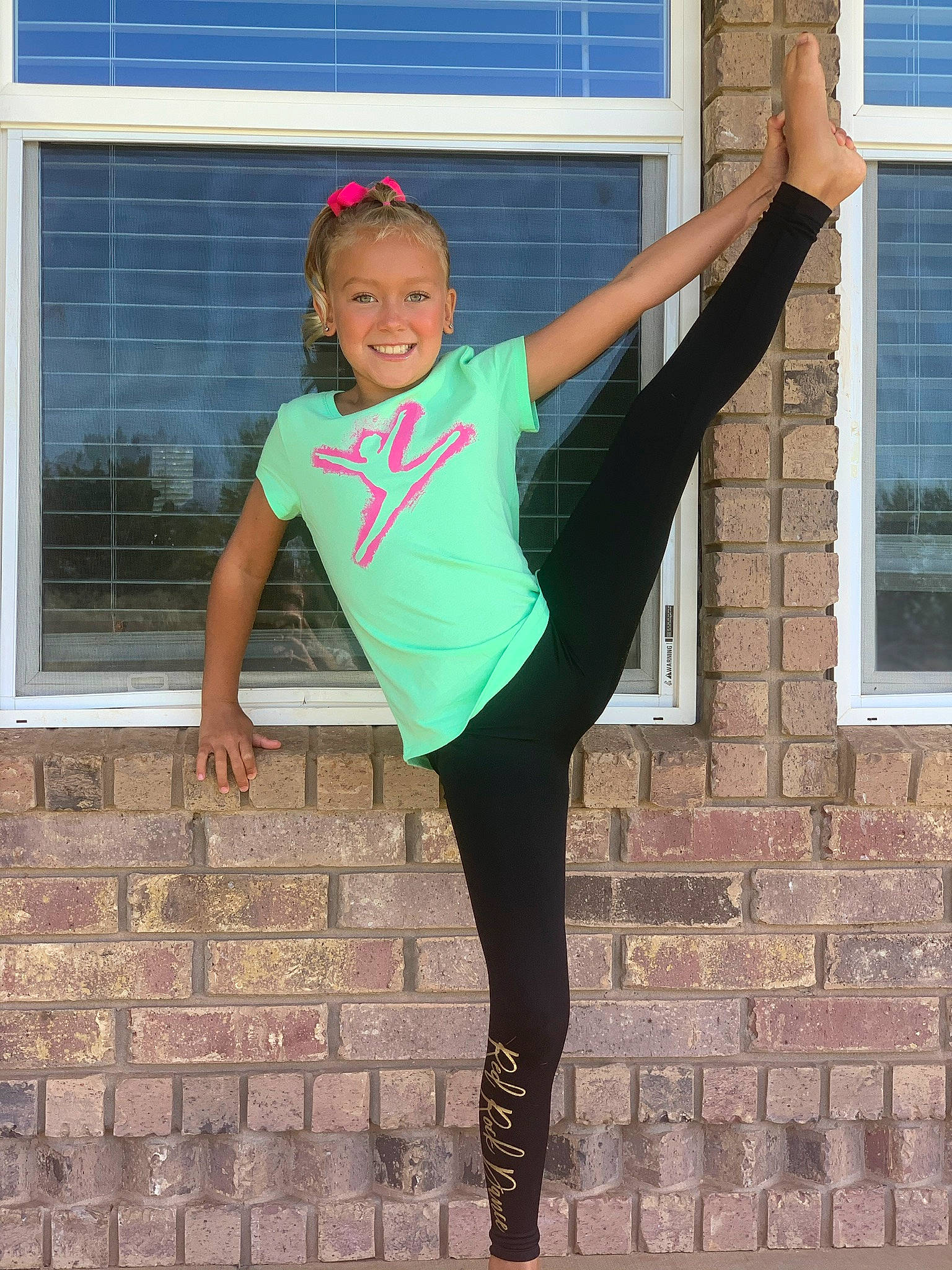 Shyanne is registered to the contest to win money with this photo: arm, balance, ballet_dancer, costume, dance, joint, joy, leg, muscle, performance, person, smile, sportswear, textile, window
