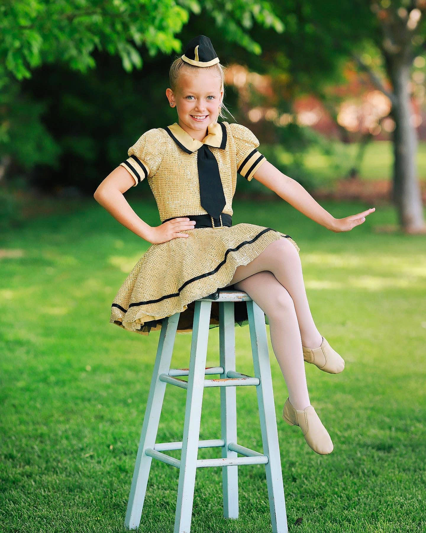 Shyanne joined the competition — help win amazing prizes! chair, fawn, fun, furniture, grass, joy, leg, leisure, outdoor_furniture, person, photography, recreation, sitting, style, table