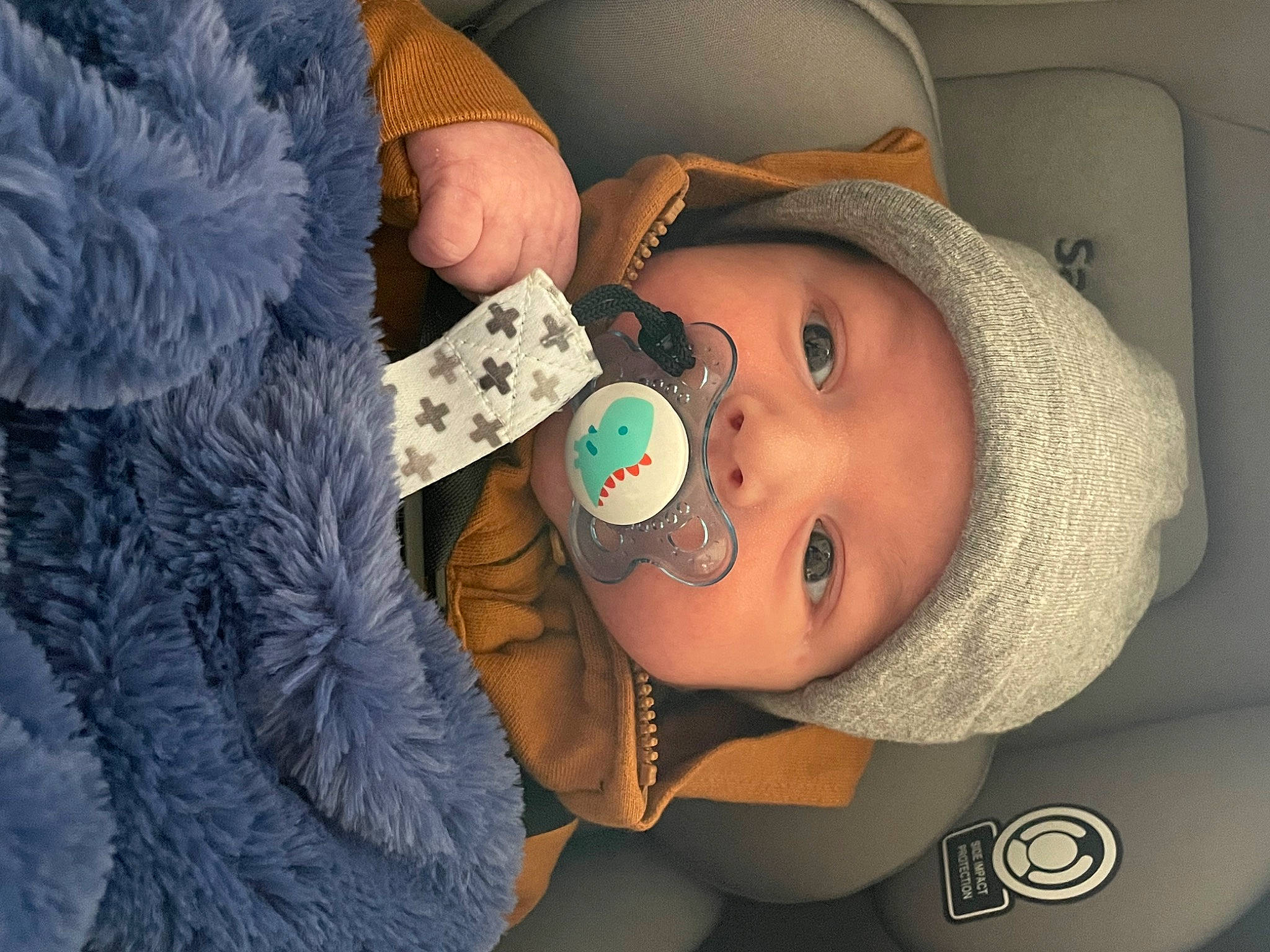 Cameron is registered to the contest to win money with this photo: baby, blue, cheek, comfort, cool, eyebrow, eyelash, finger, hairstyle, headgear, headwear, lip, mouth, nail, neck, nose, person, product, skin, sleeve