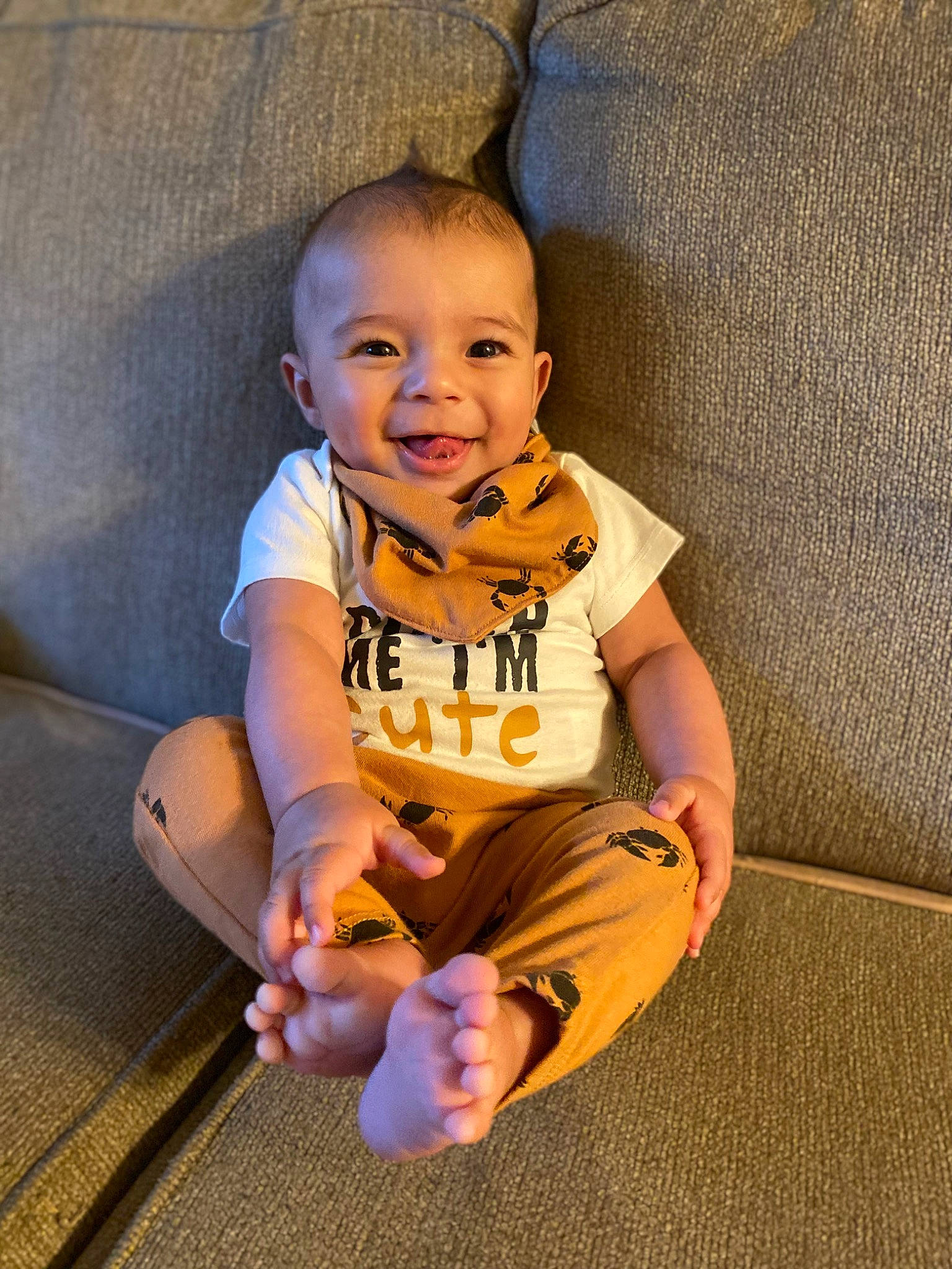 Nicholas joined the competition — help win amazing prizes! baby, baby_toddler_clothing, cheek, finger, flash_photography, floor, flooring, fun, hand, happy, human_body, human_leg, joy, nose, person, sitting, skin, sleeve, smile, t_shirt