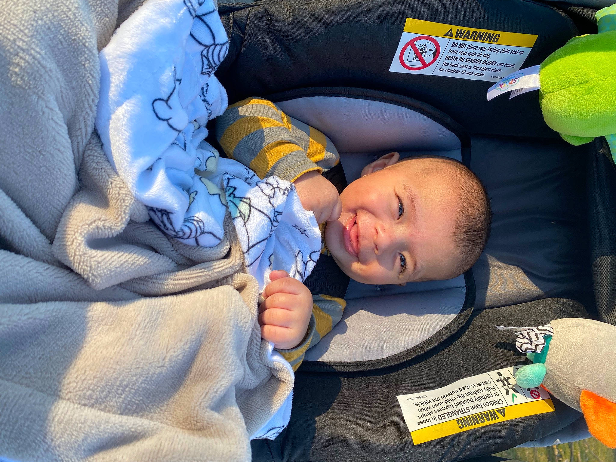 Nicholas is registered to the contest to win money with this photo: baby, baby_products, baby_safety, baby_toddler_clothing, ball, bedtime, car_seat, cheek, child, comfort, electric_blue, finger, fun, joy, linens, nap, person, room, sitting, sleep