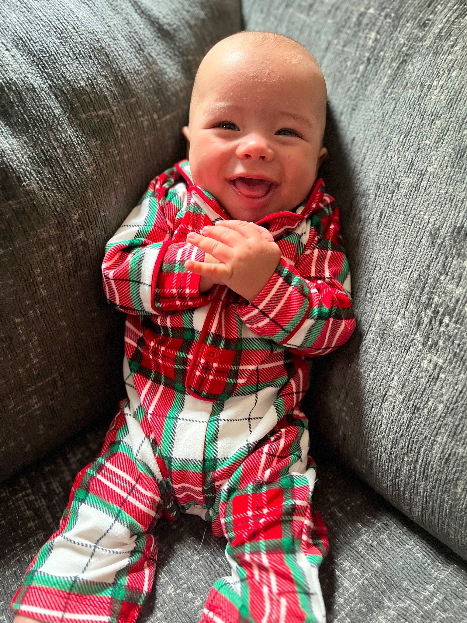 Emmett joined the competition — help win amazing prizes! baby, baby_toddler_clothing, child, collar, comfort, couch, grass, happy, head, linens, outerwear, pattern, person, plaid, red, sitting, sleeve, smile, tartan, textile